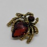 Golden spider brooch