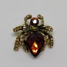 Golden spider brooch