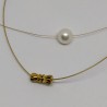 Pearl on golden wire